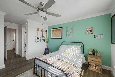 a bed room with furniture and windows