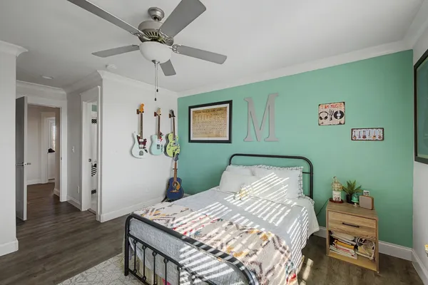 a bed room with furniture and windows