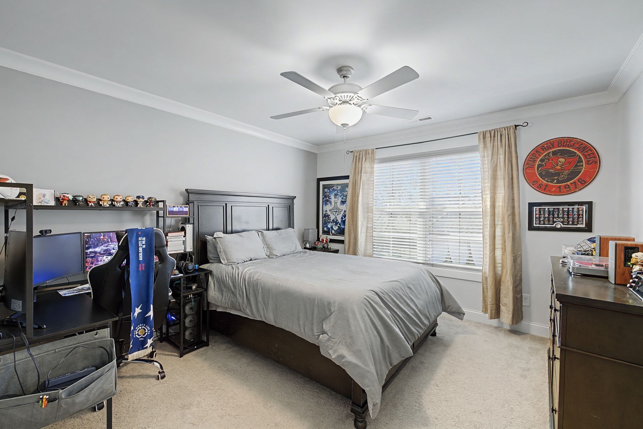 2965 Stewart Campbell Pointe Spring Hill, TN 37174 - Photo 32 of 48 a bedroom with a bed and a chandelier