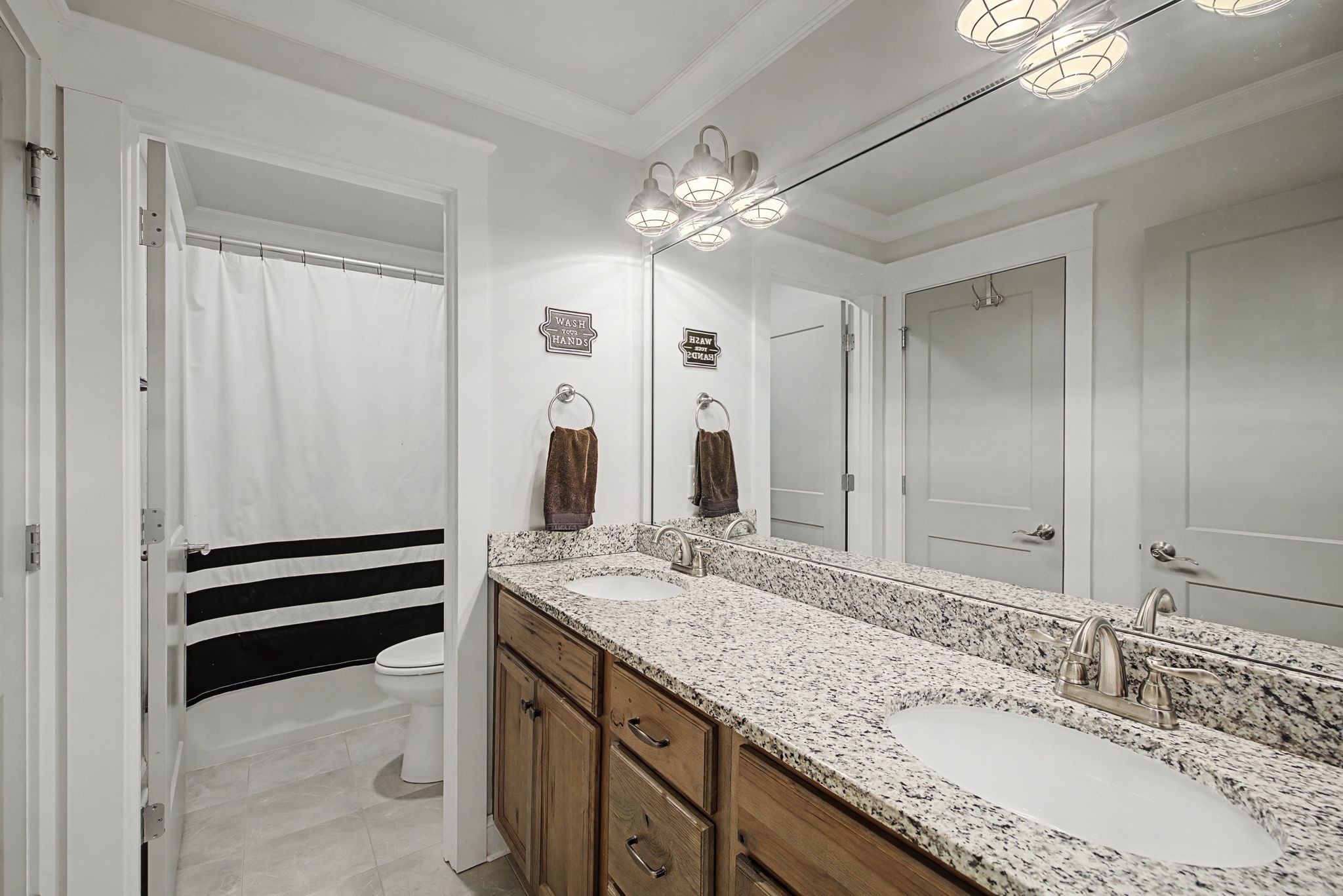 2965 Stewart Campbell Pointe Spring Hill, TN 37174 - Photo 35 of 48 a bathroom with a granite countertop sink and a mirror