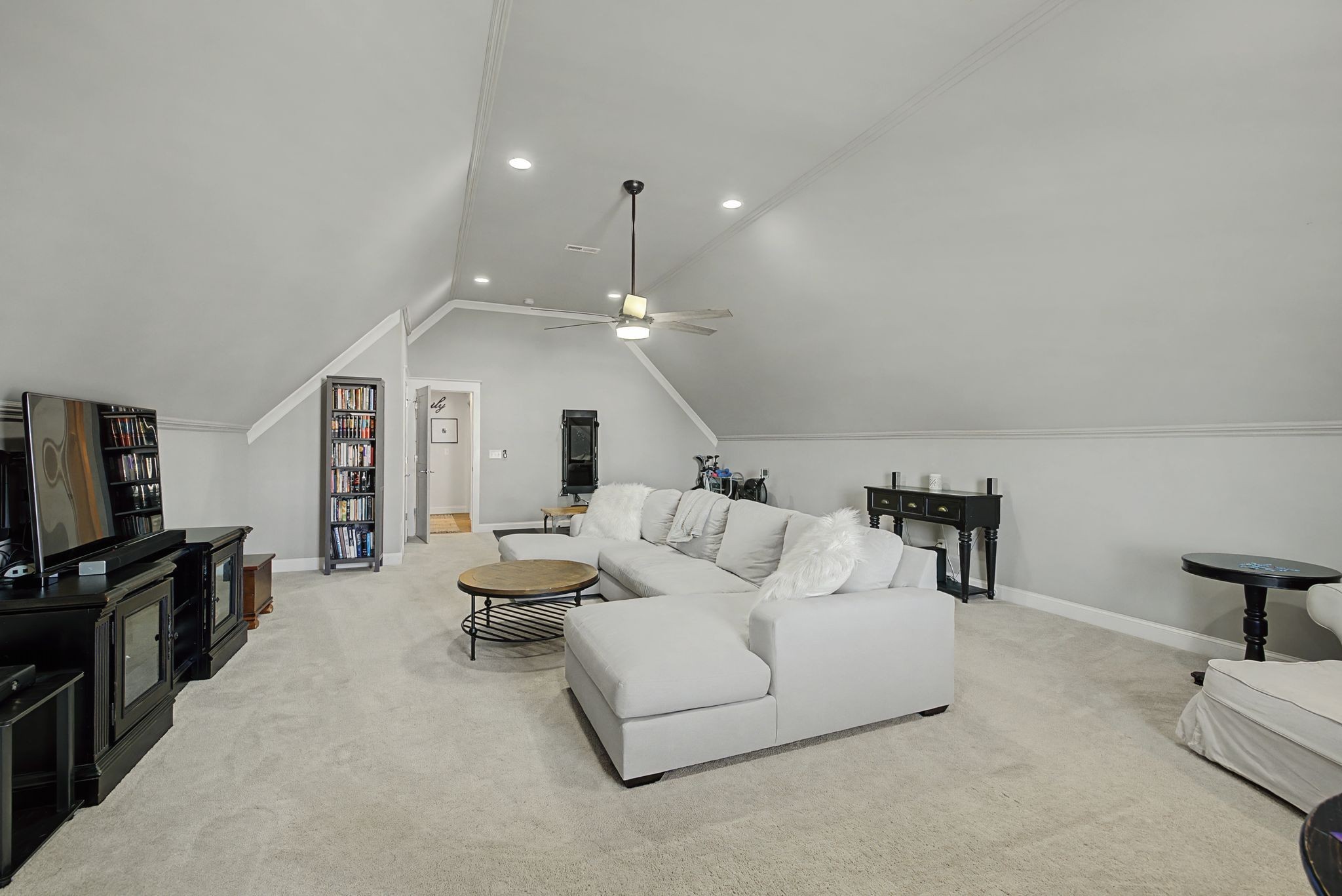 2965 Stewart Campbell Pointe Spring Hill, TN 37174 - Photo 38 of 48 a living room with furniture and a flat screen tv