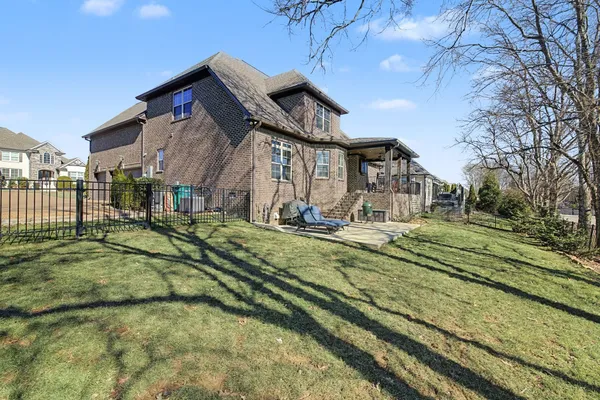 a wooden bench sitting in front of a building