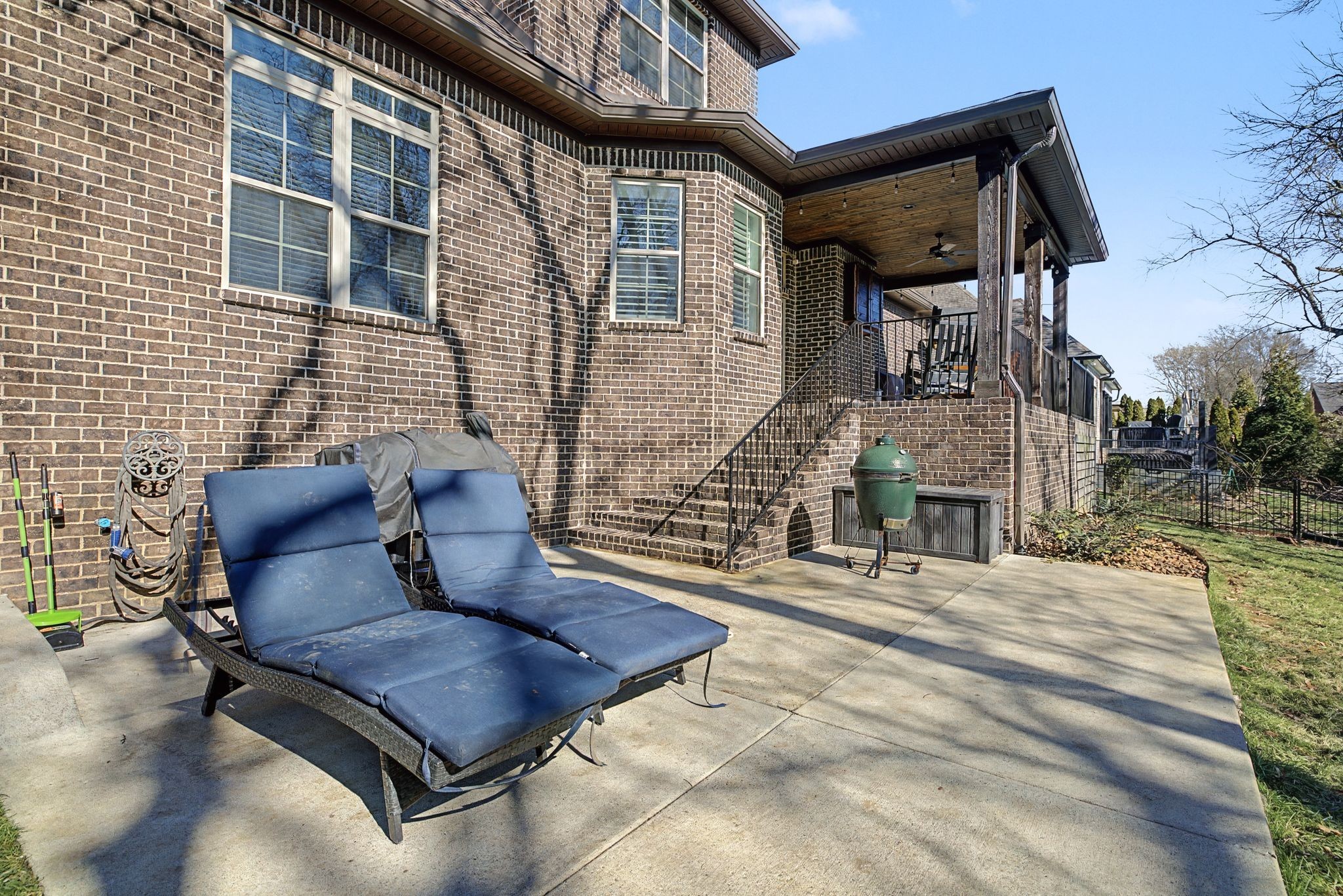 2965 Stewart Campbell Pointe Spring Hill, TN 37174 - Photo 43 of 48 a wooden bench sitting in front of a building