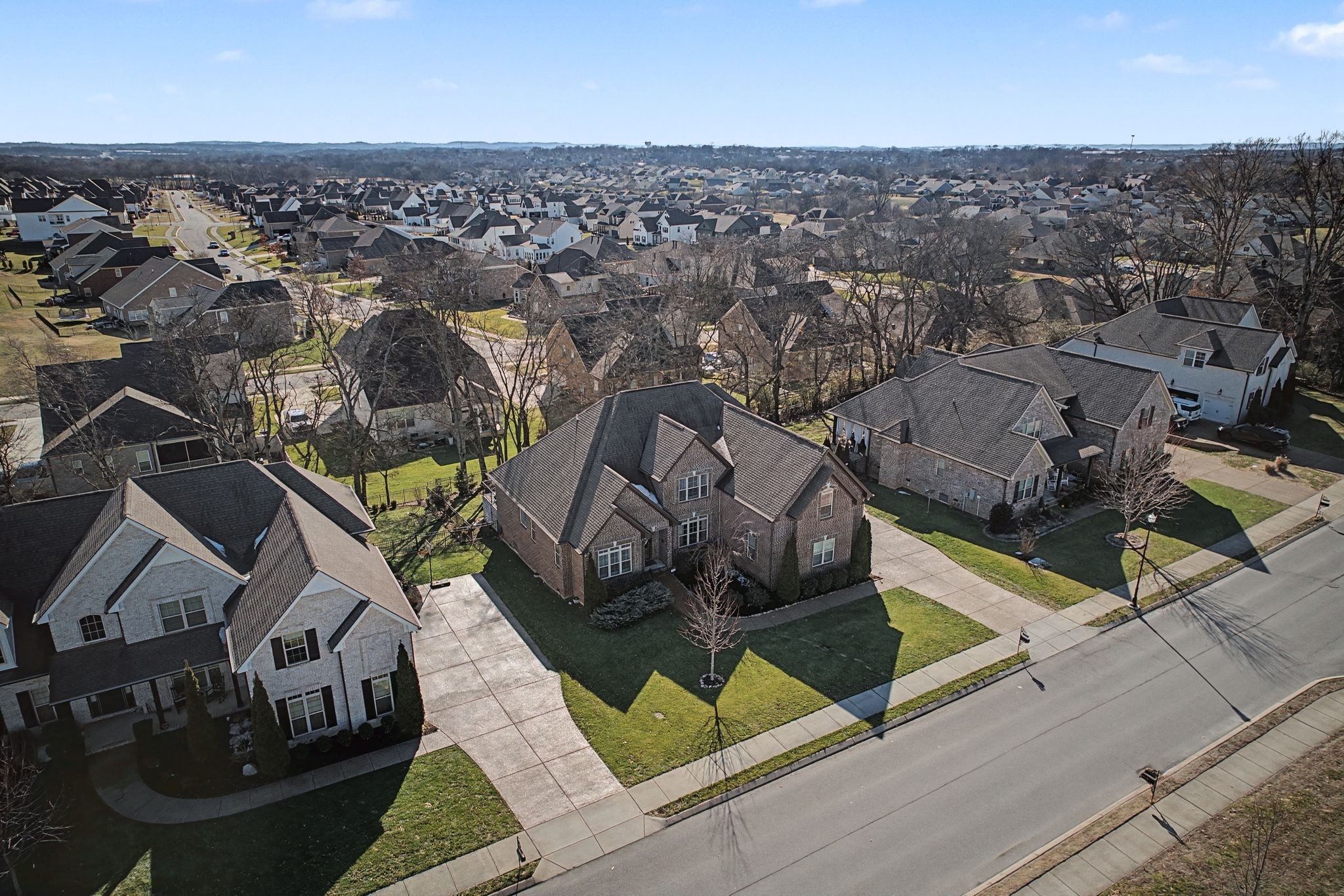 2965 Stewart Campbell Pointe Spring Hill, TN 37174 - Photo 45 of 48 an aerial view of a house with garden space and parking