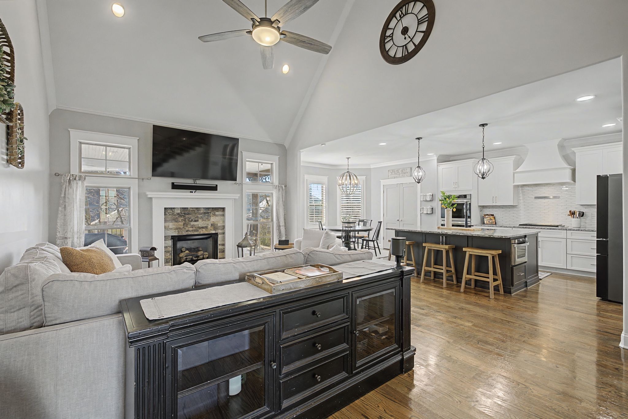 2965 Stewart Campbell Pointe Spring Hill, TN 37174 - Photo 7 of 48 a living room with furniture a fireplace and a flat screen tv