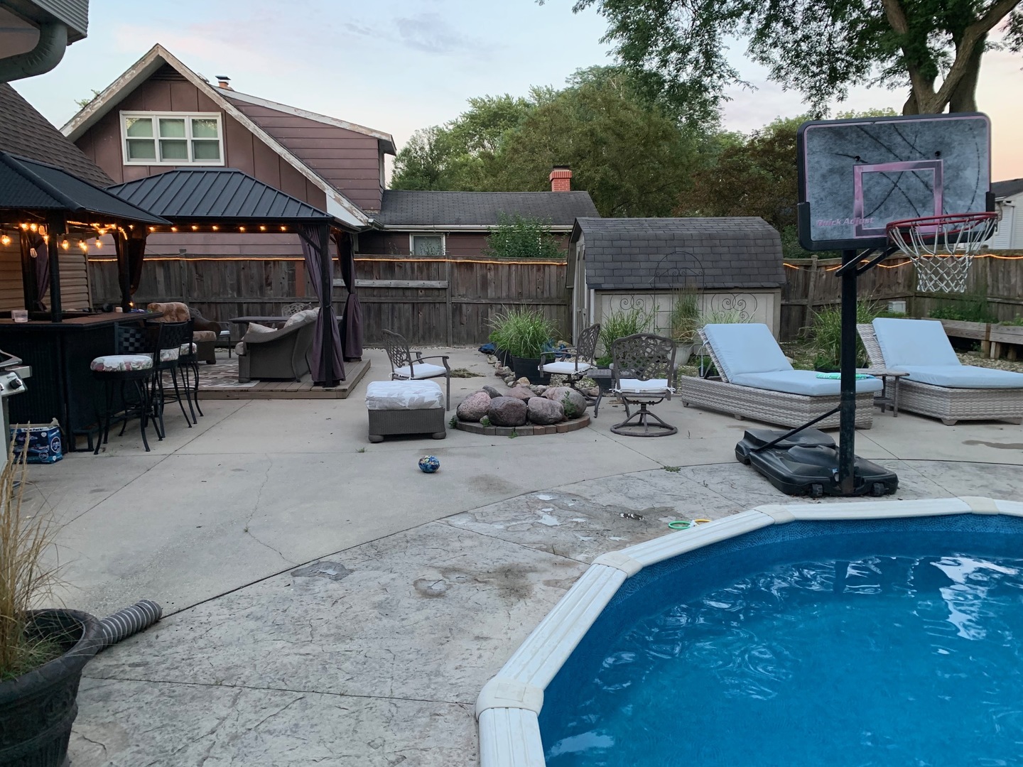 4633 Gettysburg Drive Rolling Meadows, IL 60008 - Photo 26 of 29 a view of a patio with table and chairs under an umbrella