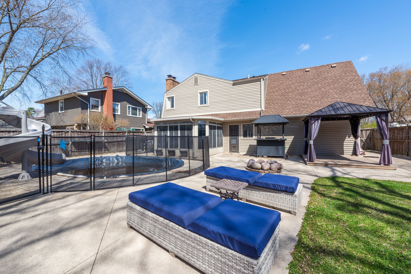 4633 Gettysburg Drive Rolling Meadows, IL 60008 - Photo 28 of 29 a front view of a house with swimming pool