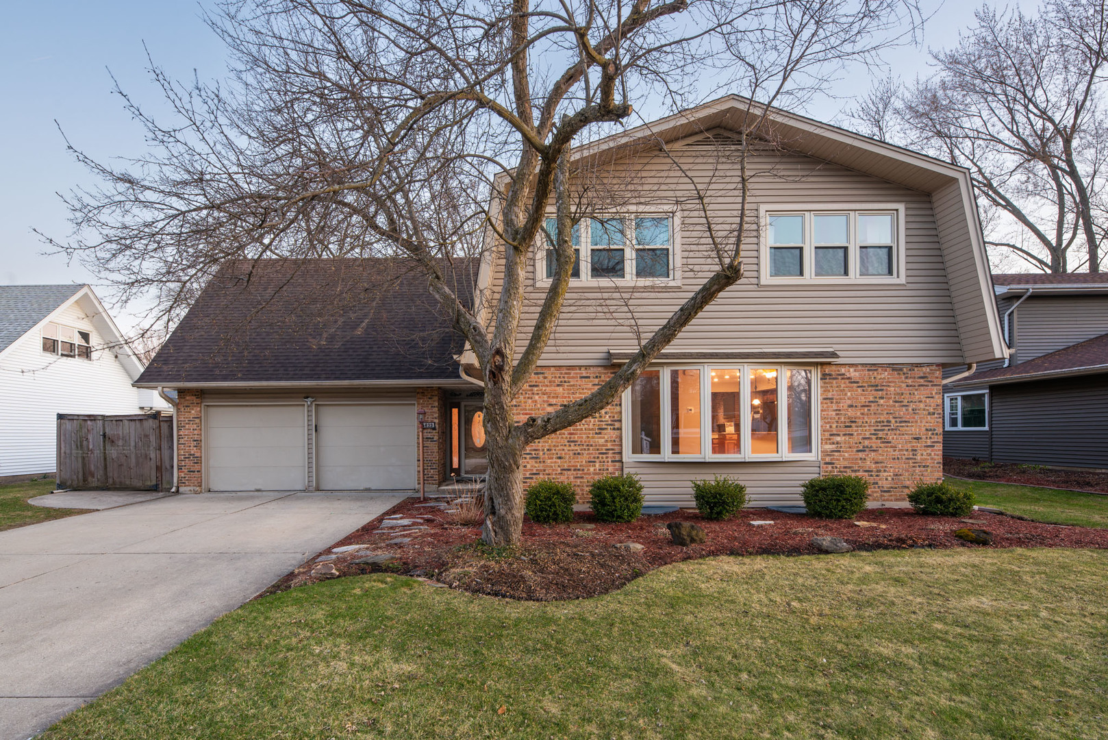 4633 Gettysburg Drive Rolling Meadows, IL 60008 - Photo 29 of 29 a front view of a house with a yard and garage