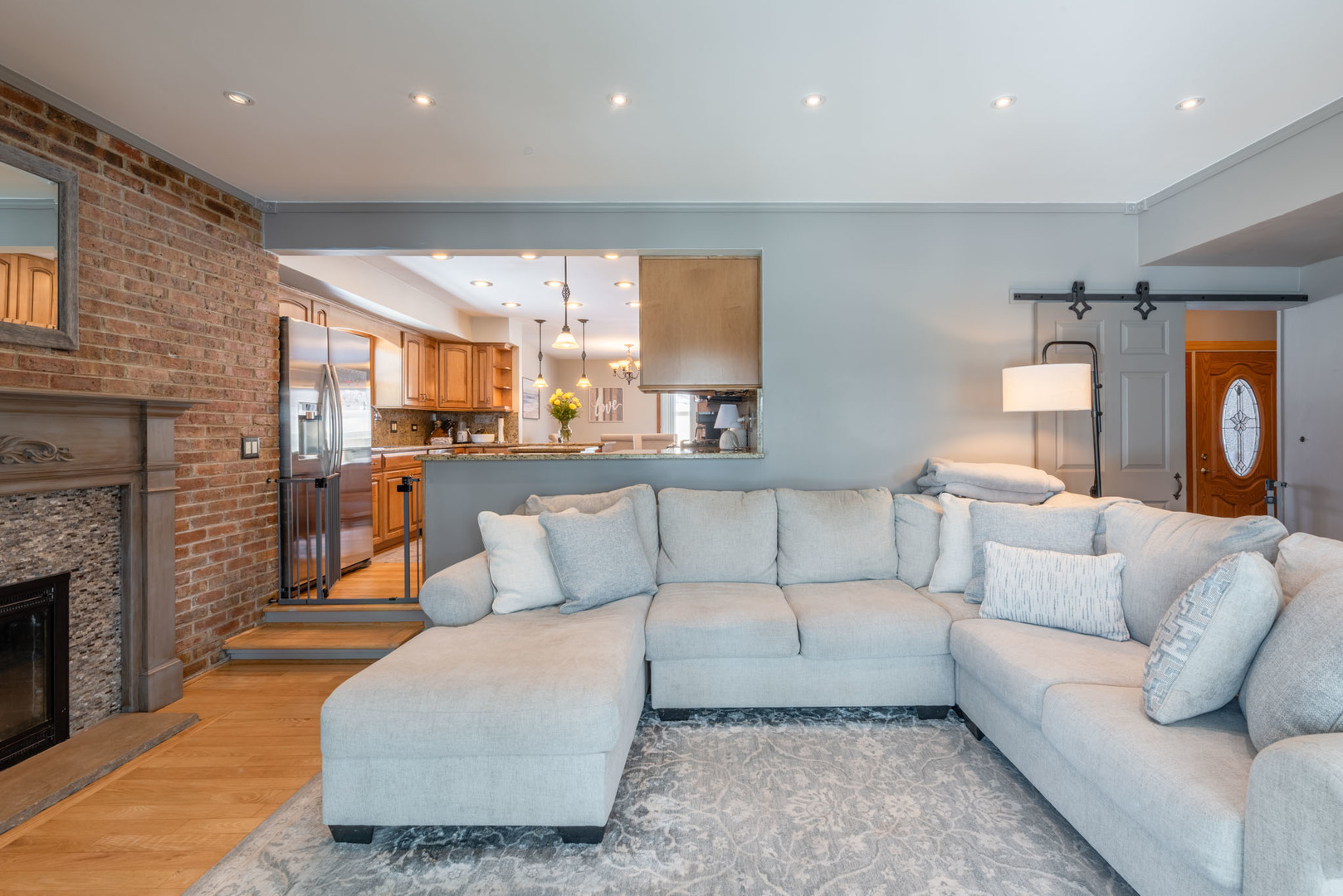 4633 Gettysburg Drive Rolling Meadows, IL 60008 - Photo 4 of 29 a living room with furniture and a fireplace