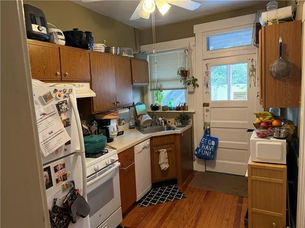 a kitchen with stainless steel appliances a stove a refrigerator sink and cabinets
