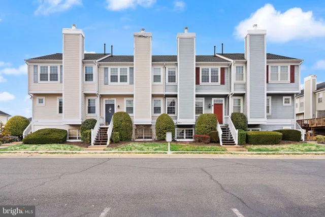 a view of a brick building next to a yard