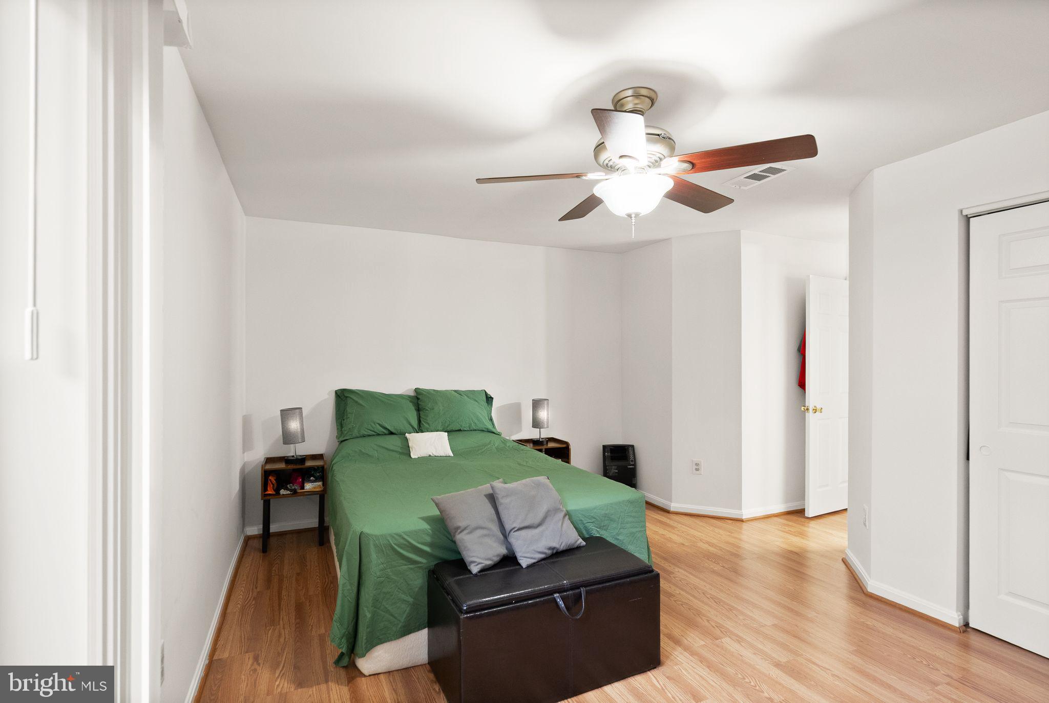 8003 Copperfield Way Manassas, VA 20109 - Photo 10 of 27 a living room with furniture and a wooden floor