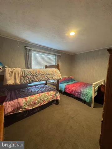 a bedroom with a bed and closet