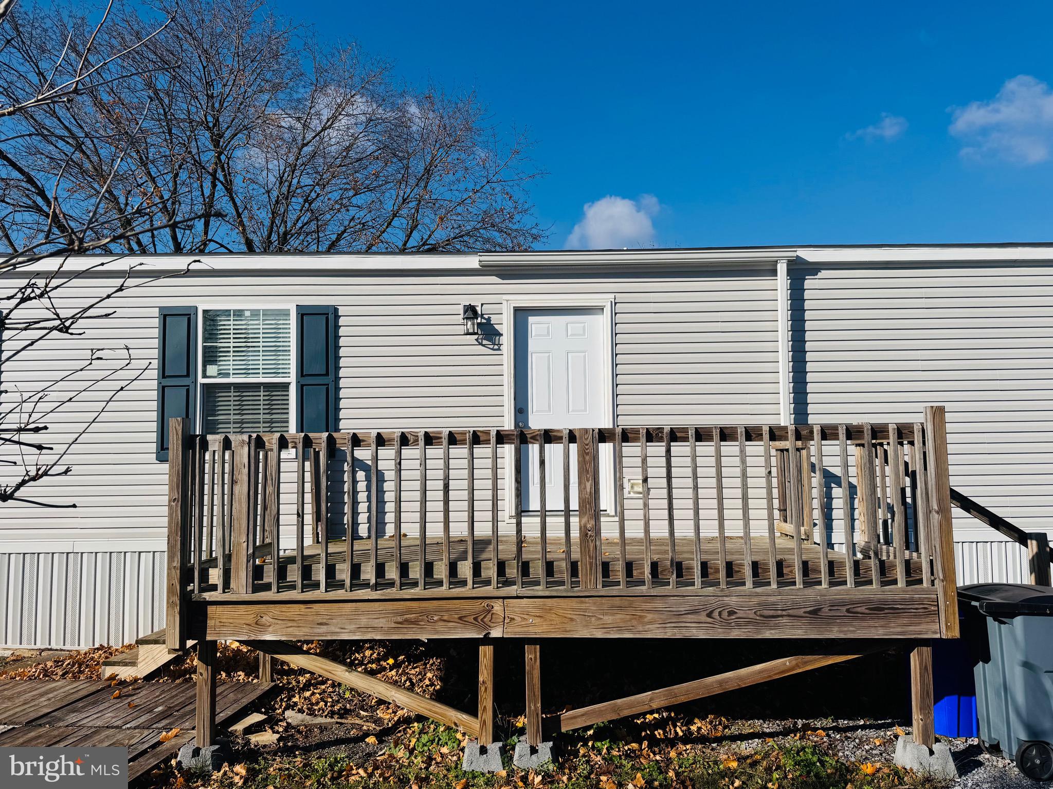720 Mountain Road Pine Grove, PA 17963 - Photo 2 of 35 a porch with a bench next to a yard