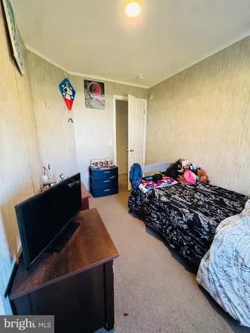 a bed room with a bed and a couch