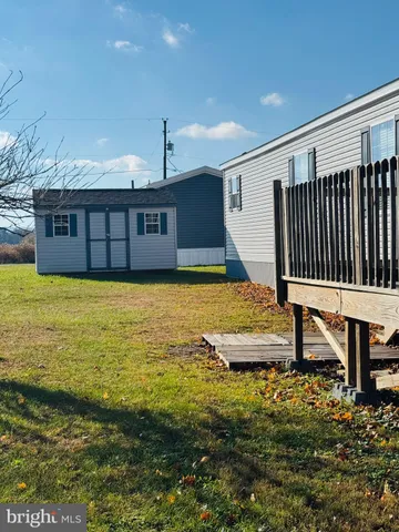 a view of a swimming pool with deck