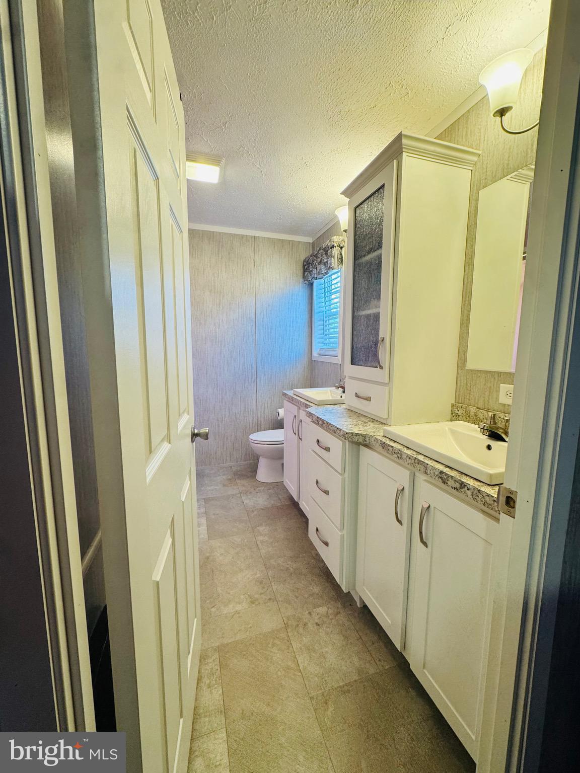 720 Mountain Road Pine Grove, PA 17963 - Photo 10 of 35 a bathroom with a double vanity sink and mirror