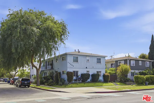 a view of a building with a yard
