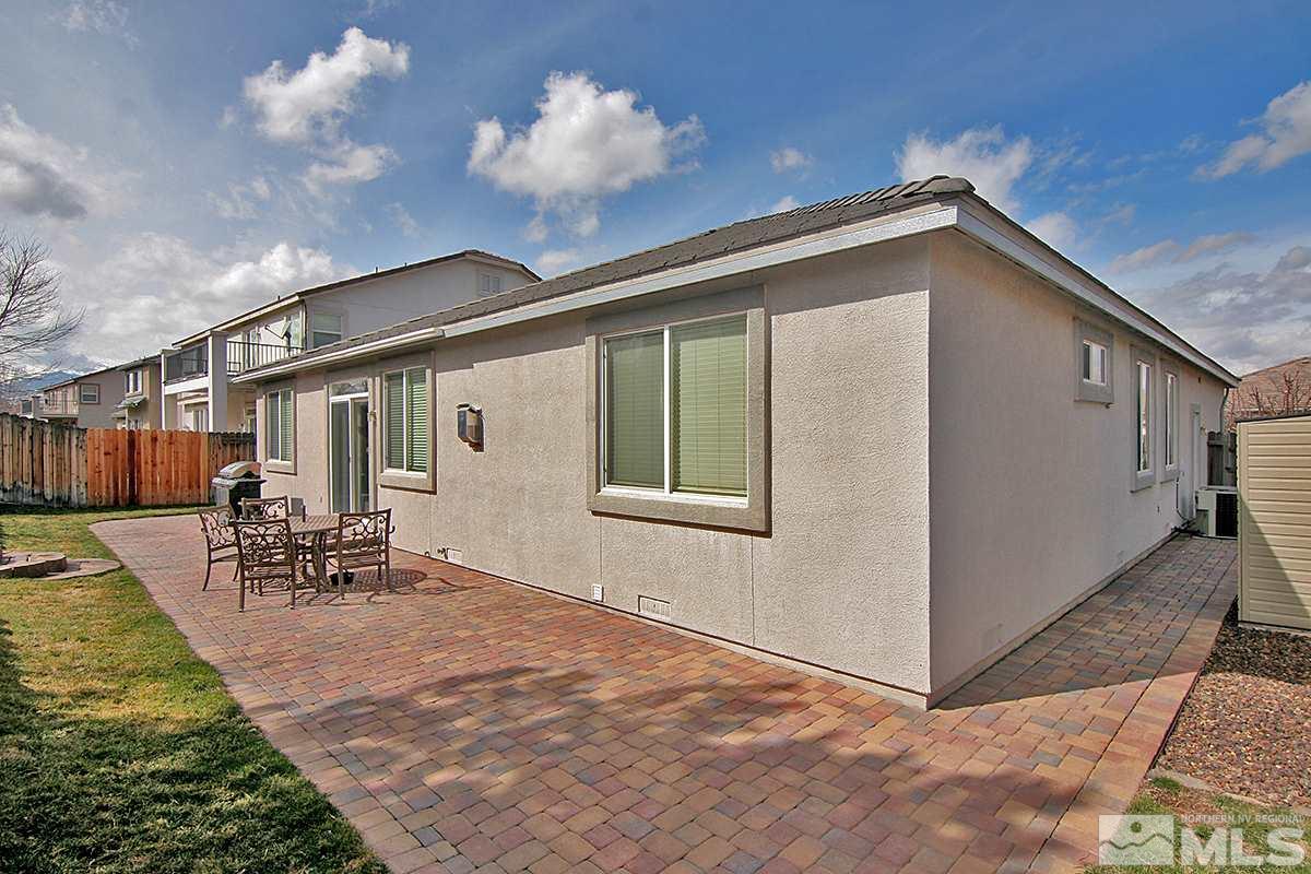 10860 Rushing Flume Drive Reno, NV 89521 - Photo 22 of 23 a view of a house with backyard and a sitting area