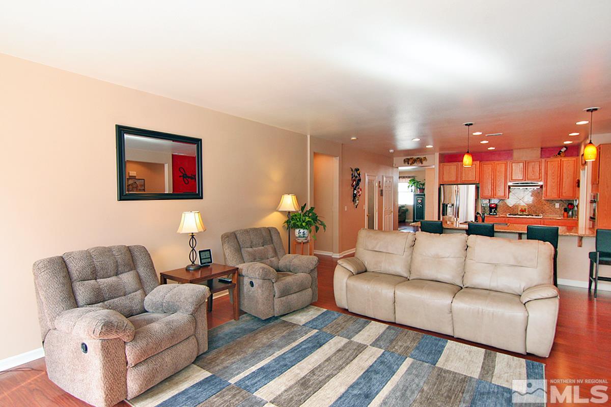 10860 Rushing Flume Drive Reno, NV 89521 - Photo 7 of 23 a living room with furniture and a view of kitchen