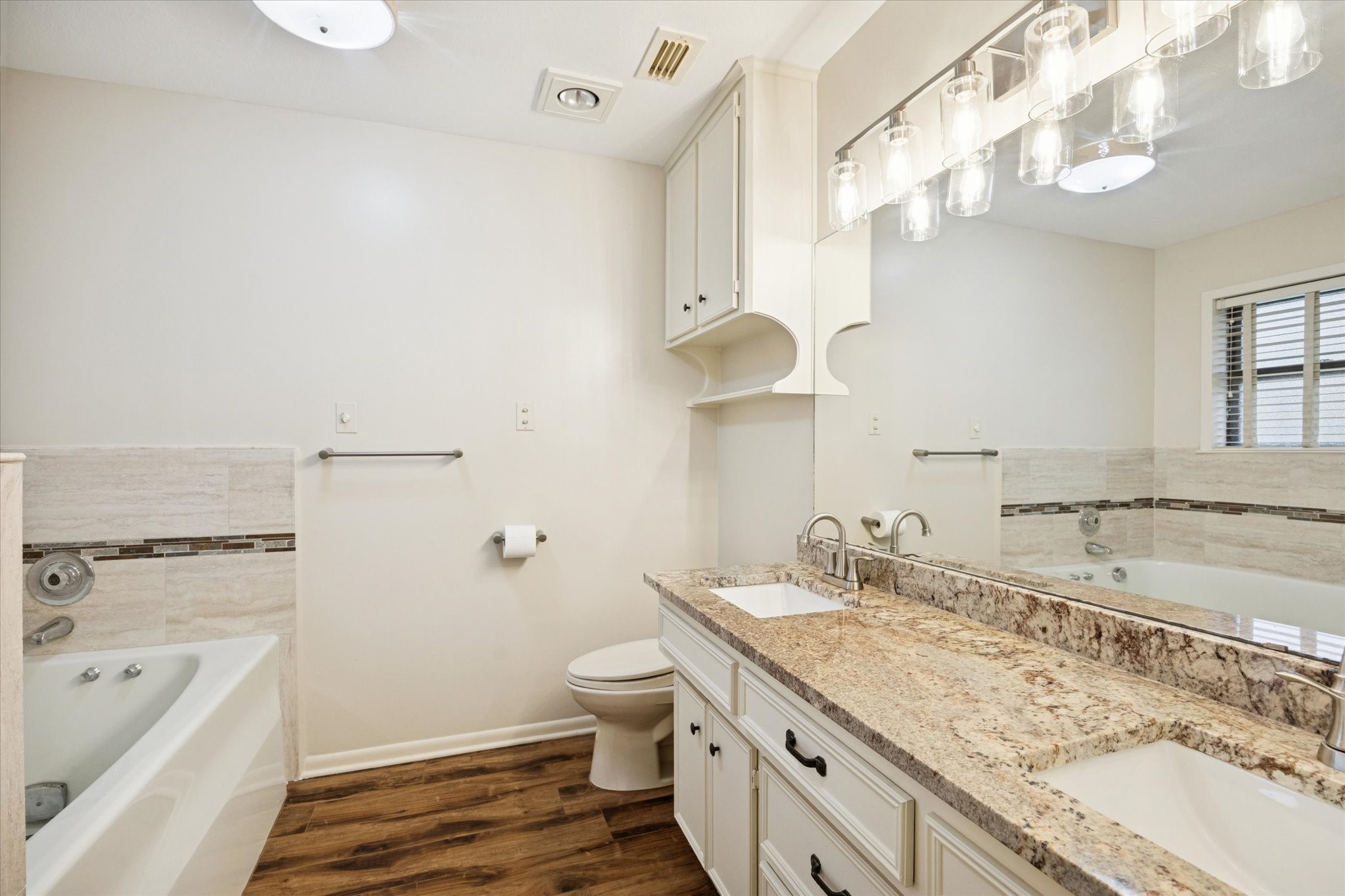 479 South Farm To Market 331 Road Sealy, TX 77474 - Photo 11 of 25 a bathroom with a granite countertop sink a toilet and bathtub