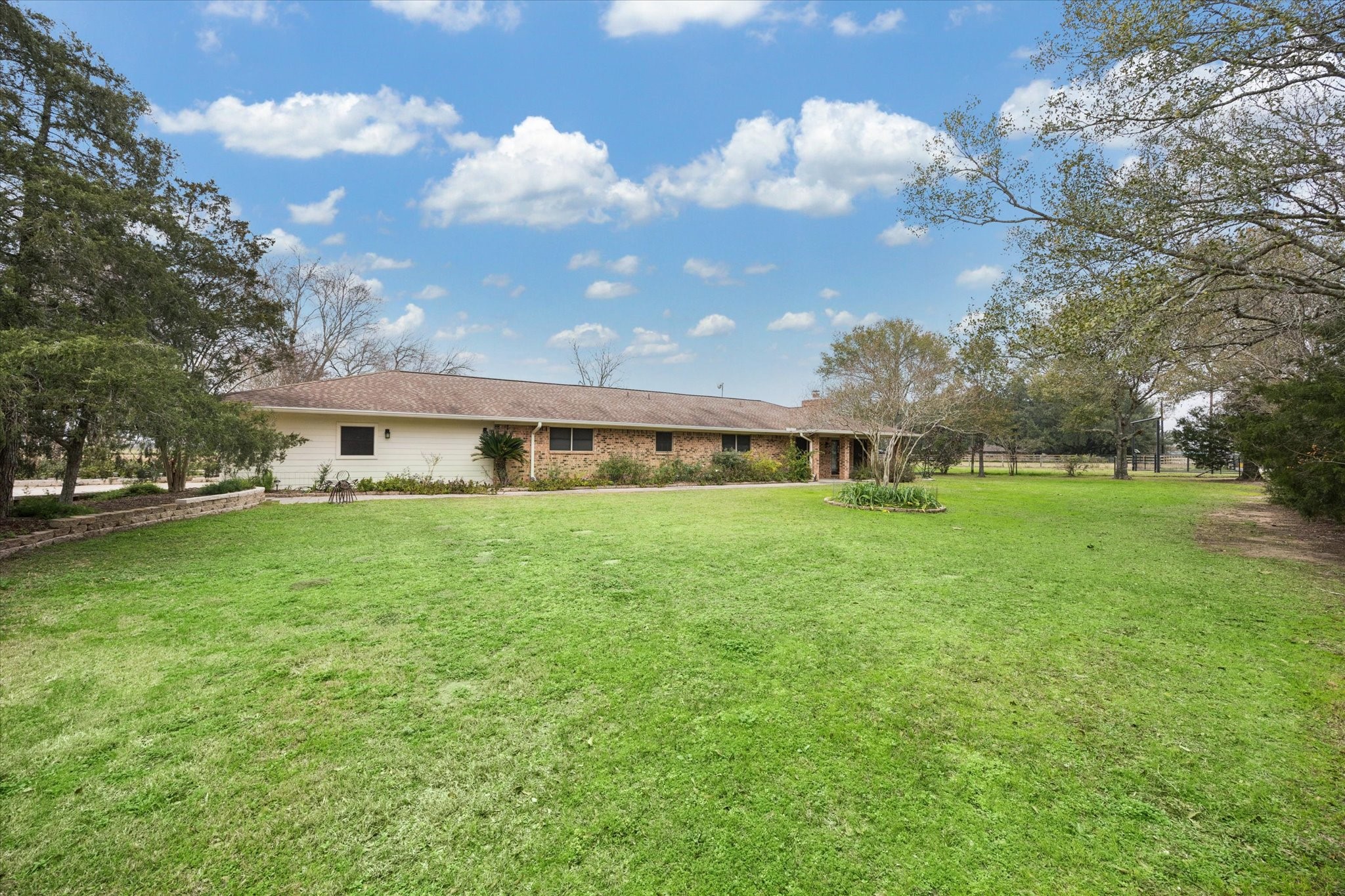 479 South Farm To Market 331 Road Sealy, TX 77474 - Photo 25 of 25 a front view of a house with garden