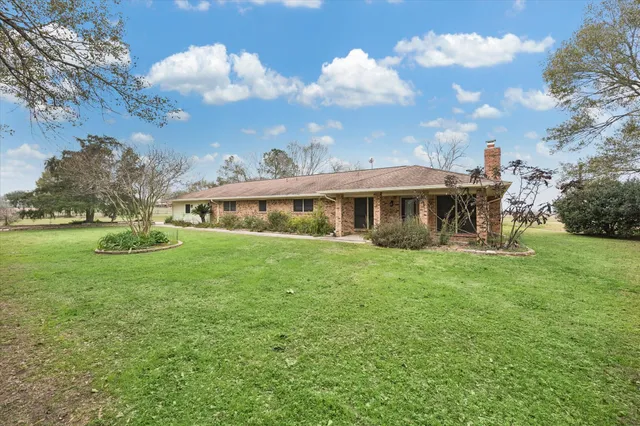 a view of house with garden