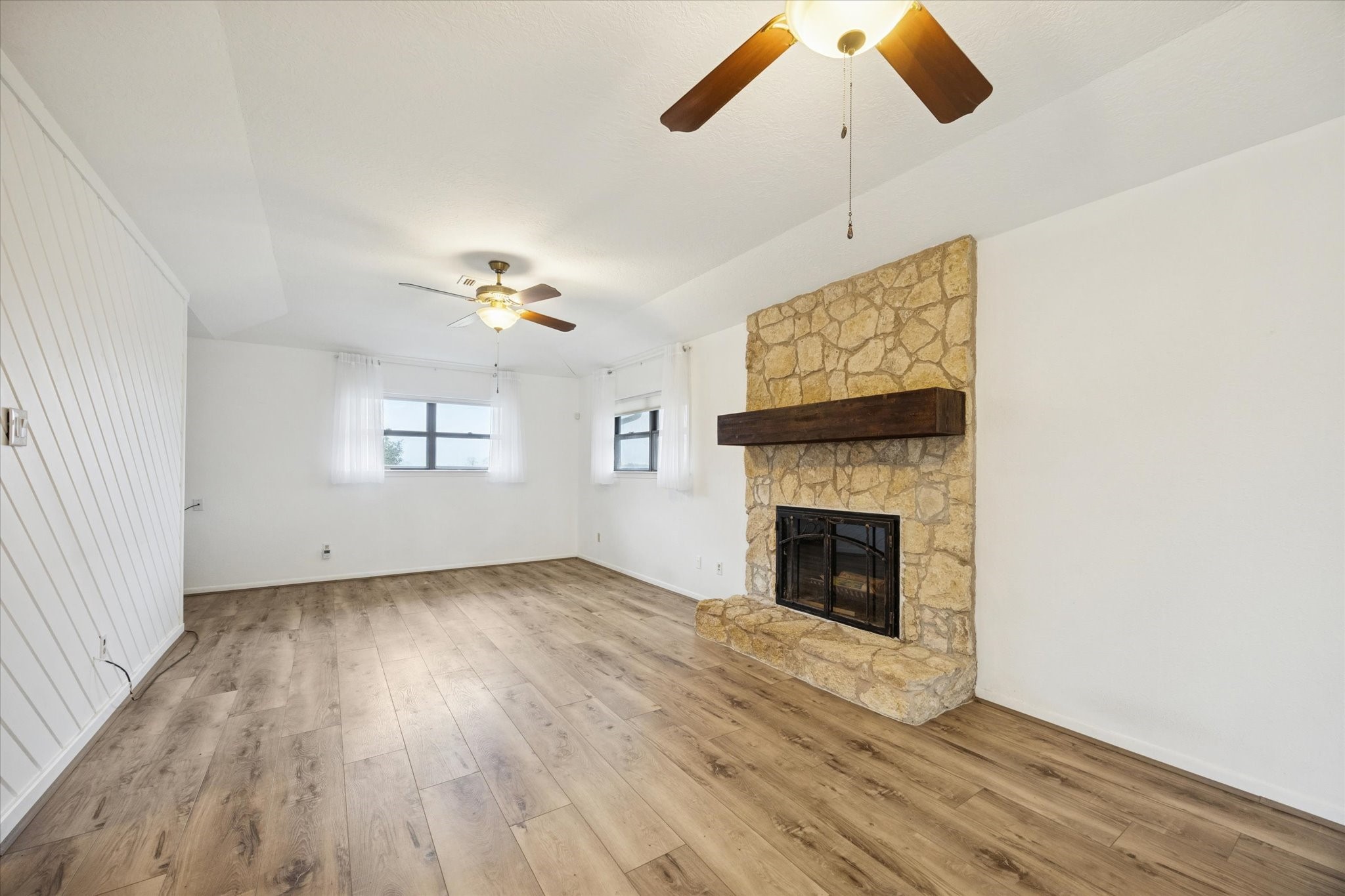 479 South Farm To Market 331 Road Sealy, TX 77474 - Photo 6 of 25 a view of an empty room with window and wooden floor