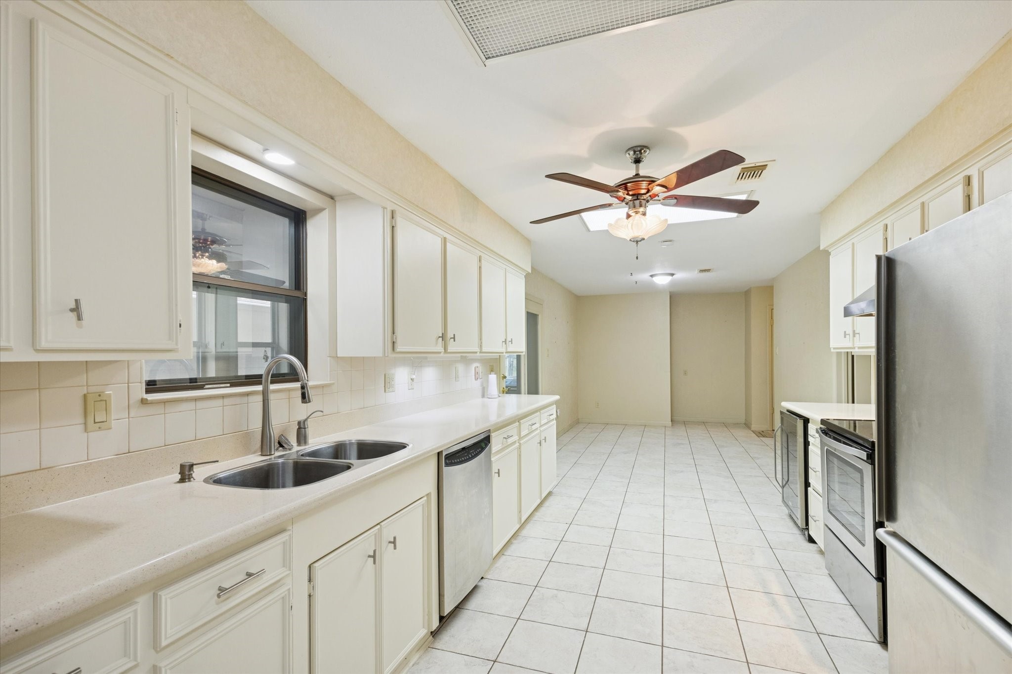 479 South Farm To Market 331 Road Sealy, TX 77474 - Photo 8 of 25 a kitchen with stainless steel appliances granite countertop a sink refrigerator and cabinets