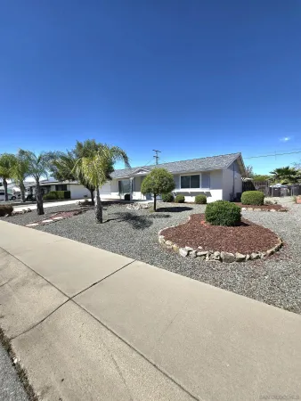 a view of a road with a building in the background