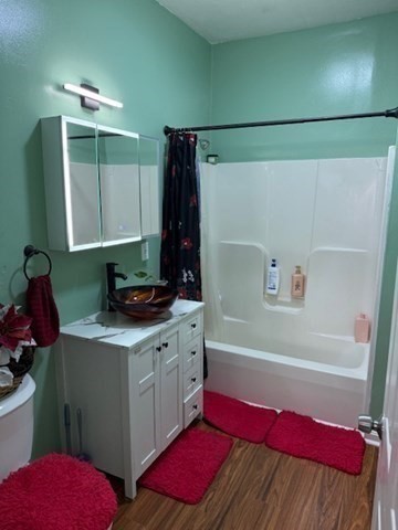 10 Byron Street Worcester, MA 01605 - Photo 15 of 33 a bathroom with a tub sink and mirror