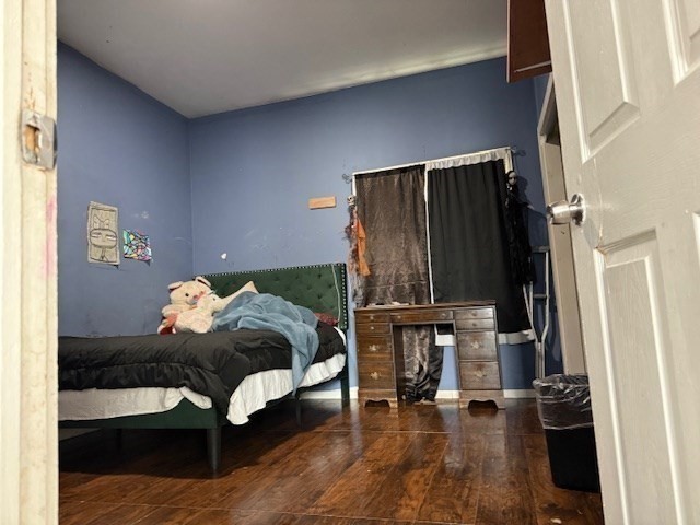 10 Byron Street Worcester, MA 01605 - Photo 8 of 33 a bedroom with a bed and wooden floor