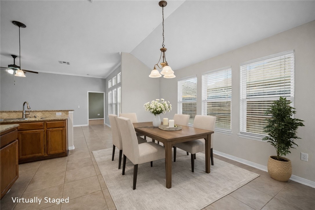 7509 Exeter Corpus Christi, TX 78414 - Photo 11 of 29 a view of a dining room and kitchen with a table chairs