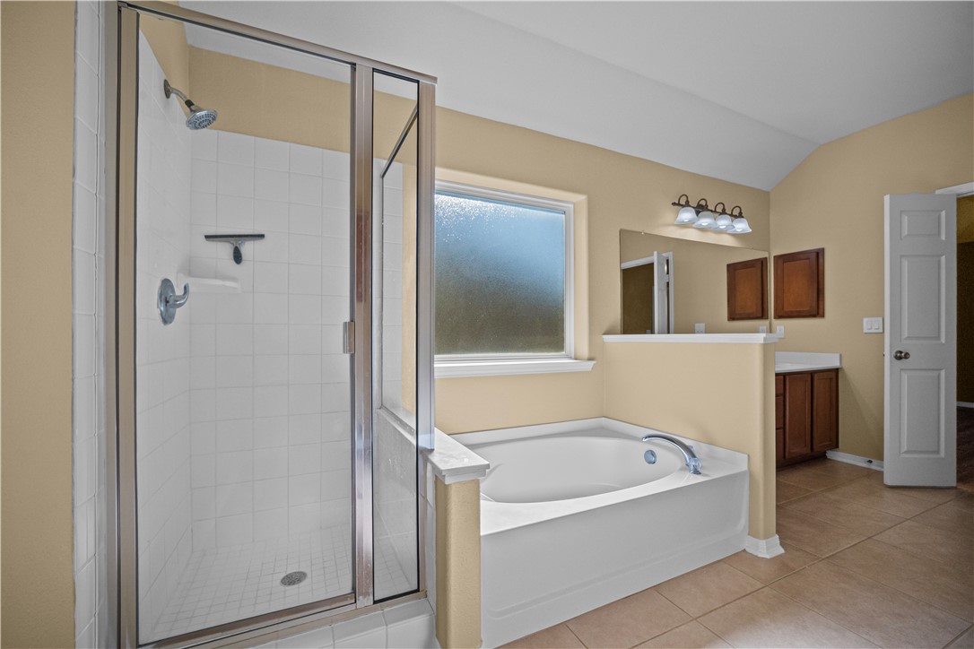 7509 Exeter Corpus Christi, TX 78414 - Photo 18 of 29 a bathroom with a bathtub and a shower