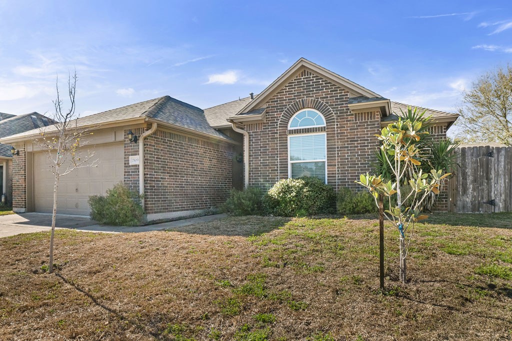 7509 Exeter Corpus Christi, TX 78414 - Photo 2 of 29 a front view of a house with garden