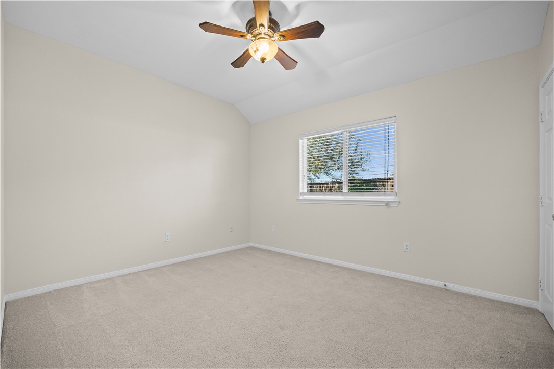 7509 Exeter Corpus Christi, TX 78414 - Photo 21 of 29 an empty room with a window and a fan
