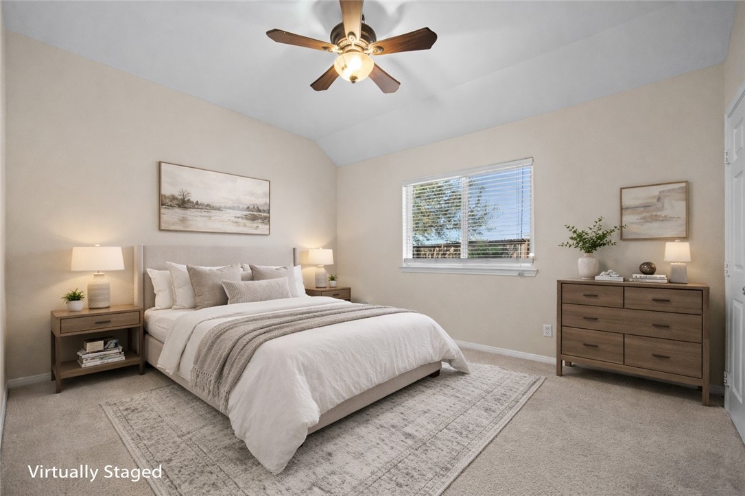 7509 Exeter Corpus Christi, TX 78414 - Photo 22 of 29 a bedroom with a bed and a chandelier