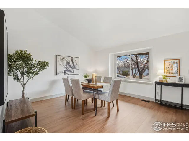 a view of a dining room with furniture and window