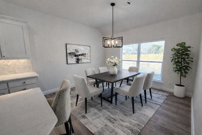 25 Pear Tree Lane Collinsville, TX 76233 - Photo 12 of 34 a view of a dining room with furniture window and wooden floor