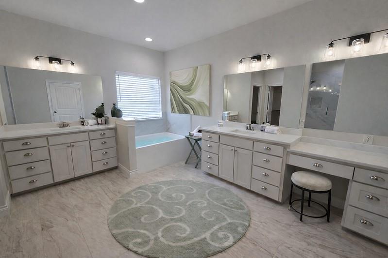 25 Pear Tree Lane Collinsville, TX 76233 - Photo 15 of 34 a spacious bathroom with a double vanity sink mirror and bathtub