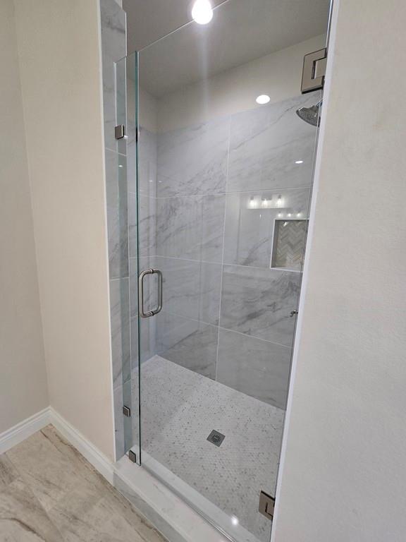 25 Pear Tree Lane Collinsville, TX 76233 - Photo 17 of 34 a bathroom with a shower