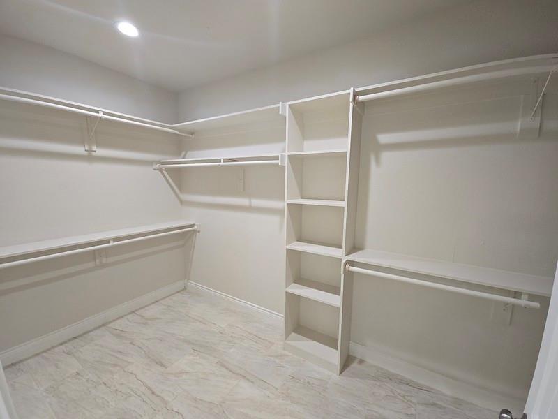 25 Pear Tree Lane Collinsville, TX 76233 - Photo 18 of 34 a view of an empty walk in closet