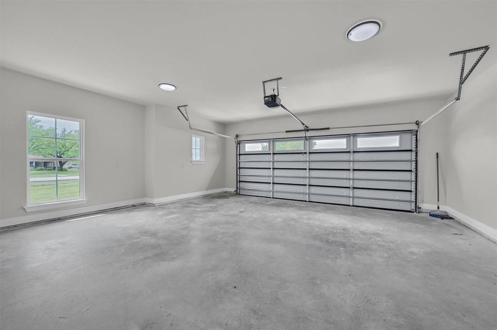 25 Pear Tree Lane Collinsville, TX 76233 - Photo 30 of 34 a view of a room with stairs and a window