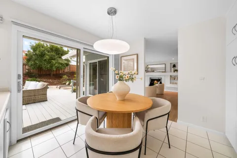 a view of a dining room with furniture wooden floor and a chandelier