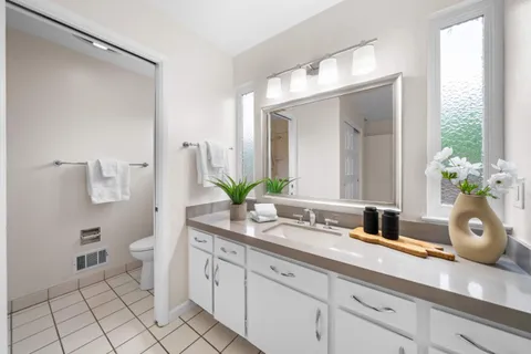 a bathroom with a shower a toilet and a shower