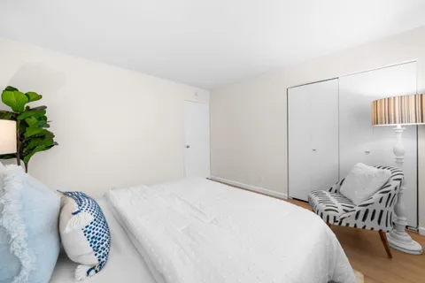 a bedroom with a bed and window