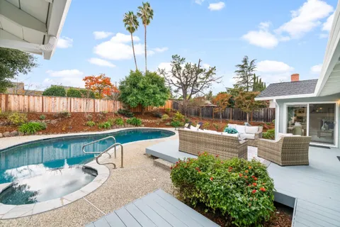 a view of a swimming pool with a patio