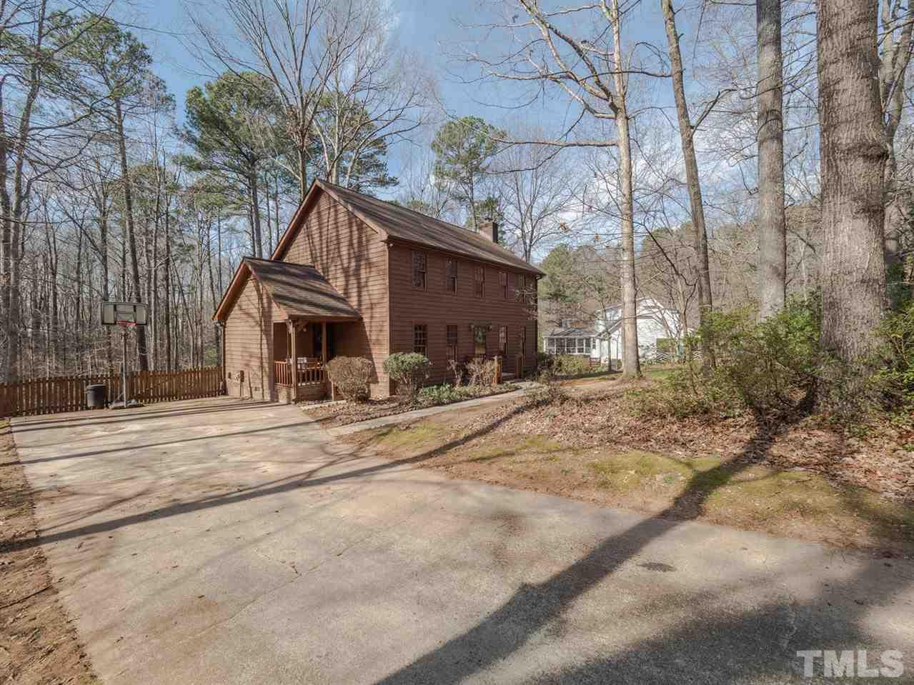 8317 Druids Lane Raleigh, NC 27613 - Photo 2 of 24 Long driveway with plenty of parking and room to add a garage.