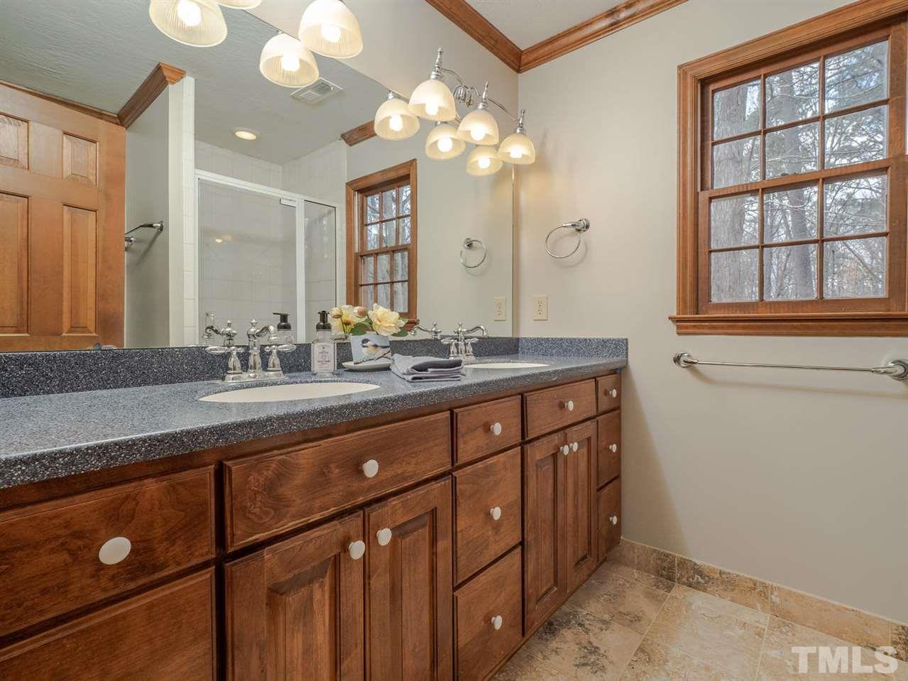 8317 Druids Lane Raleigh, NC 27613 - Photo 15 of 24 Master bathroom with large double vanity and walk in shower.