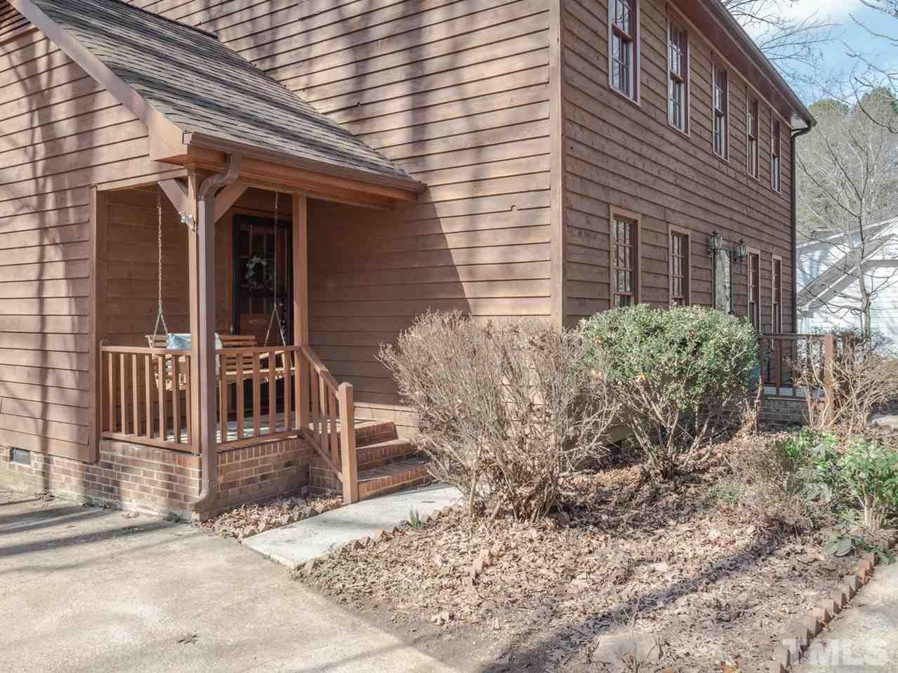 8317 Druids Lane Raleigh, NC 27613 - Photo 3 of 24 Great side porch with wood swing!